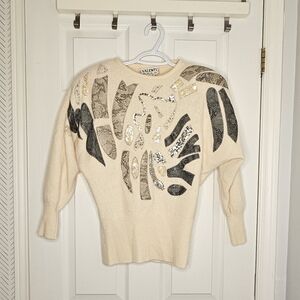 Cream Sweater with Black and Silver Accents